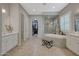 Spa-like bathroom with soaking tub, walk-in shower, and double vanity at 18125 W Acacia Dr, Goodyear, AZ 85338