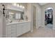 Vanity area in a spacious bathroom with a large mirror and ample storage at 18125 W Acacia Dr, Goodyear, AZ 85338