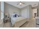 Spacious bedroom with plush bed and access to a private gym at 18125 W Acacia Dr, Goodyear, AZ 85338