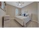 Comfortable bedroom with a king-size bed and plenty of natural light at 18125 W Acacia Dr, Goodyear, AZ 85338