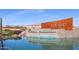 Lucero community entrance features a water element and modern design at 18125 W Acacia Dr, Goodyear, AZ 85338