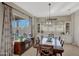 Dining room with a large table, built-in cabinetry, and window seating at 18125 W Acacia Dr, Goodyear, AZ 85338