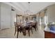 Spacious dining area with a large table and views into the kitchen at 18125 W Acacia Dr, Goodyear, AZ 85338