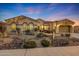 Beautiful single-story home with desert landscaping and a three-car garage at 18125 W Acacia Dr, Goodyear, AZ 85338