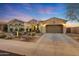 Beautiful single-story home with desert landscaping and a three-car garage at 18125 W Acacia Dr, Goodyear, AZ 85338