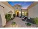 Inviting front courtyard with seating area, perfect for relaxing evenings at 18125 W Acacia Dr, Goodyear, AZ 85338