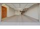 Spacious garage with overhead storage and built-in cabinets at 18125 W Acacia Dr, Goodyear, AZ 85338