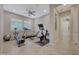 Home gym with treadmill, exercise bike, and weights at 18125 W Acacia Dr, Goodyear, AZ 85338