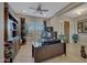 Home office with built-in shelving, deskspace and natural light at 18125 W Acacia Dr, Goodyear, AZ 85338