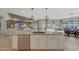 Large kitchen island with seating and stainless steel dishwasher at 18125 W Acacia Dr, Goodyear, AZ 85338