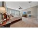 Spacious main bedroom with a king bed, and large windows with plantation shutters at 18125 W Acacia Dr, Goodyear, AZ 85338