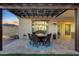 Outdoor patio with fire pit table and seating area under a pergola at 18125 W Acacia Dr, Goodyear, AZ 85338