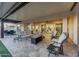 Relaxing covered patio with fire pit and comfortable seating at 18125 W Acacia Dr, Goodyear, AZ 85338