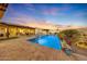 Inviting pool area with expansive patio and outdoor entertaining space at 18125 W Acacia Dr, Goodyear, AZ 85338