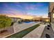 Backyard with a beautiful pool, spacious patio, and lush landscaping at 18125 W Acacia Dr, Goodyear, AZ 85338