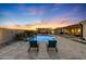 Relax by the pool with lounge chairs, a pergola, and a spacious patio at 18125 W Acacia Dr, Goodyear, AZ 85338