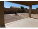View from under covered patio showing fire pit and gravel backyard at 21963 W Gardenia Dr, Buckeye, AZ 85326
