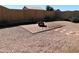 Backyard with fire pit, brick patio, and gravel landscaping at 21963 W Gardenia Dr, Buckeye, AZ 85326