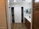 Bathroom with double vanity and walk-in closet at 21963 W Gardenia Dr, Buckeye, AZ 85326