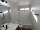 Updated bathroom with a bathtub, shower, and modern vanity at 21963 W Gardenia Dr, Buckeye, AZ 85326