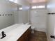 Clean bathroom with tub, toilet and vanity at 21963 W Gardenia Dr, Buckeye, AZ 85326