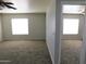 Spacious bedroom with carpet and large windows at 21963 W Gardenia Dr, Buckeye, AZ 85326
