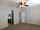 Bright bedroom with ceiling fan and carpet at 21963 W Gardenia Dr, Buckeye, AZ 85326