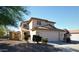 Two-story house with attached garage and landscaped front yard at 21963 W Gardenia Dr, Buckeye, AZ 85326