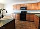Bright kitchen features ample cabinetry, updated appliances, and a double sink at 21963 W Gardenia Dr, Buckeye, AZ 85326