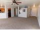 Open floor plan connecting living room, kitchen, and entryway at 21963 W Gardenia Dr, Buckeye, AZ 85326
