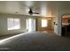 Open floor plan, combining living and dining areas with kitchen access at 21963 W Gardenia Dr, Buckeye, AZ 85326