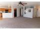 Open concept living room with kitchen and staircase views at 21963 W Gardenia Dr, Buckeye, AZ 85326