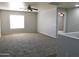 Bright loft bedroom with large window and carpet at 21963 W Gardenia Dr, Buckeye, AZ 85326