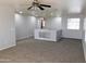 Spacious loft area with carpet and ceiling fan at 21963 W Gardenia Dr, Buckeye, AZ 85326