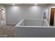Loft hallway with access to bedrooms and bath at 21963 W Gardenia Dr, Buckeye, AZ 85326