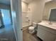 Clean bathroom with a tub, shower, and white vanity at 23246 W Miami St, Buckeye, AZ 85326
