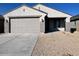 New single-story home with attached garage and neutral color scheme at 23246 W Miami St, Buckeye, AZ 85326