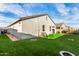 Artificial turf backyard with fire pits and a large yard at 24413 W Raymond St, Buckeye, AZ 85326