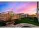 Landscaped backyard featuring a stone pathway at 24413 W Raymond St, Buckeye, AZ 85326