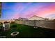 Landscaped backyard with grassy lawn at 24413 W Raymond St, Buckeye, AZ 85326