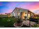 Spacious backyard, covered patio with seating, and grill at 24413 W Raymond St, Buckeye, AZ 85326
