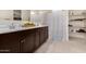 Clean bathroom with a double vanity and a shower/tub combo at 24413 W Raymond St, Buckeye, AZ 85326