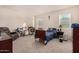 Bright bedroom with a double bed, desk, and ample closet space at 24413 W Raymond St, Buckeye, AZ 85326