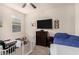 bedroom with twin bed, dresser, and play area at 24413 W Raymond St, Buckeye, AZ 85326
