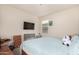 Bright bedroom with a large bed and plenty of space at 24413 W Raymond St, Buckeye, AZ 85326