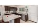 Modern kitchen with granite countertops and stainless steel dishwasher at 24413 W Raymond St, Buckeye, AZ 85326