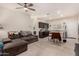 Open concept kitchen with island and dark wood cabinets at 24413 W Raymond St, Buckeye, AZ 85326