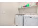 Laundry room with side-by-side washer and dryer at 24413 W Raymond St, Buckeye, AZ 85326