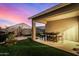Covered patio with seating area, perfect for outdoor dining at 24413 W Raymond St, Buckeye, AZ 85326