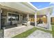 Cozy backyard patio with comfortable wicker furniture and an outdoor grill, ideal for relaxing at 27395 W Wahalla Ln, Buckeye, AZ 85396